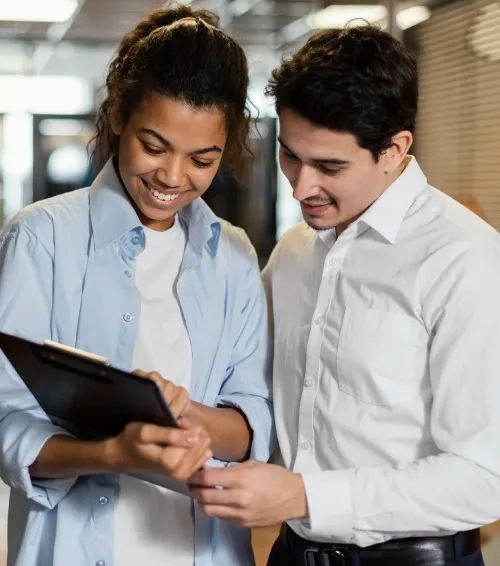 Two Arfito consultants reviewing a project on a tablet