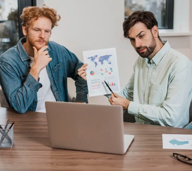 Two IT professionals reviewing a project presentation